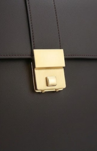 Signature gold push-lock clasp for secure professional closure