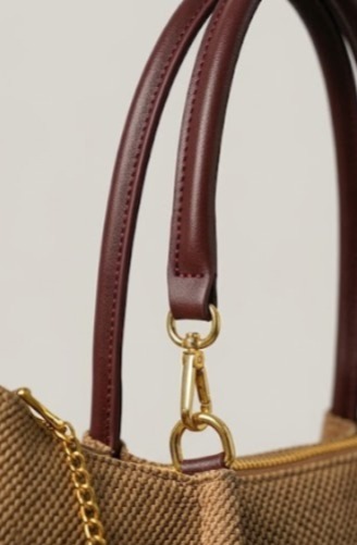 Refined burgundy leather handles and trim detailing